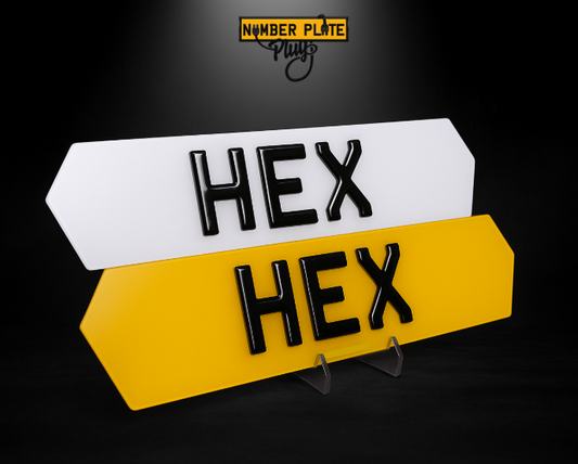 Yellow and white license plate with 'HEX' text on a black background